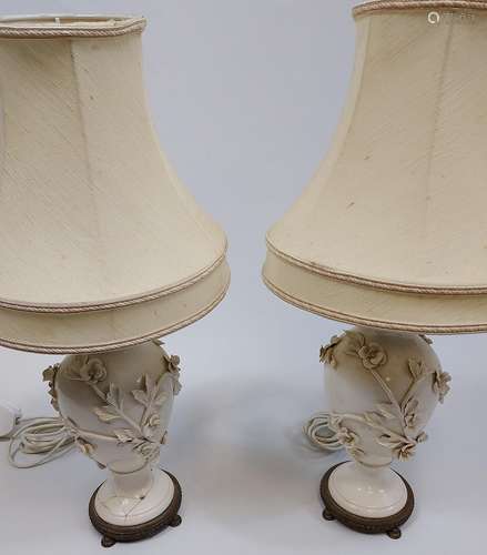 A Pair of antique blanc de chine floral design table lamps