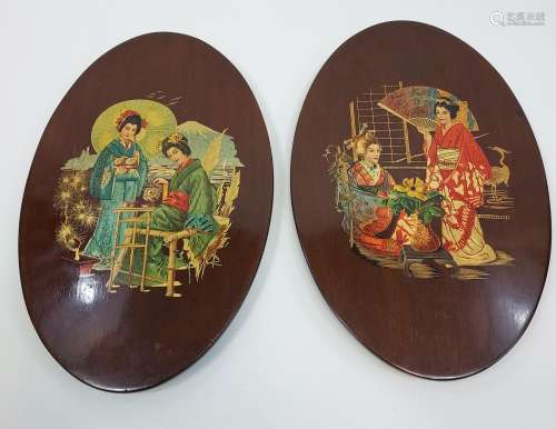 A Pair of early 1920's wooden wall panels depicting Japanese...