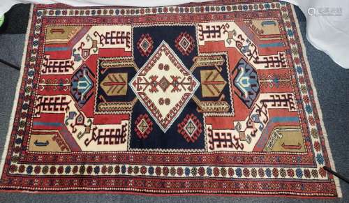 An Antique Persian Style ornate rug.