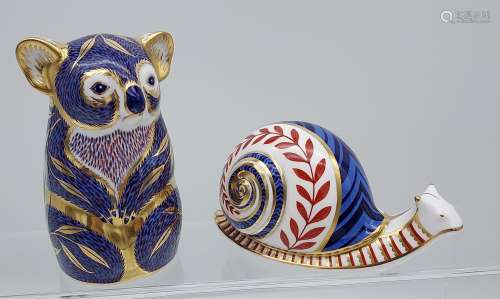 Two Royal Crown Derby figures, Kola and snail.
