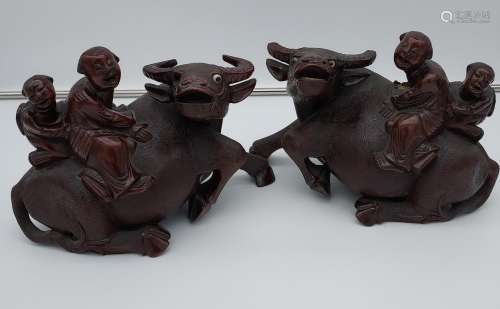 A Pair of hand carved Chinese figures sat upon a buffalo. [2...