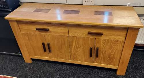 A Solid light oak sideboard, Consists of two drawers and fou...