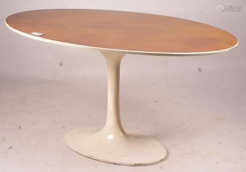 An Arkana style tulip base teak top oval dining table, lengt...