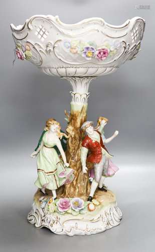 A German porcelain fruit stand, the stem decorated with four...