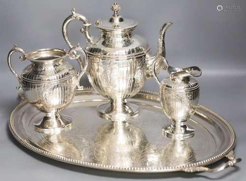 A Victorian plated engraved two handled tea tray and a plate...