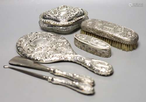 A late Victorian repousse silver mounted hand mirror, London...