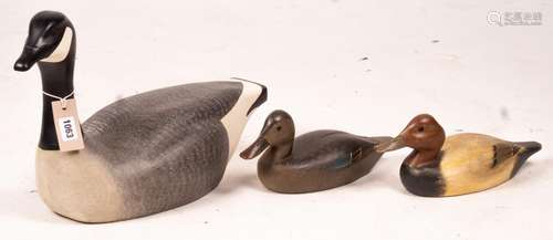 Three American carved and painted decoy duck ornaments, larg...