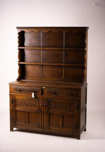 An 18th century style carved oak dresser, width 124cm, depth...
