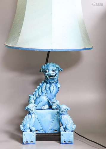 A Chinese turquoise glazed Buddhist lion table lamp and a pa...