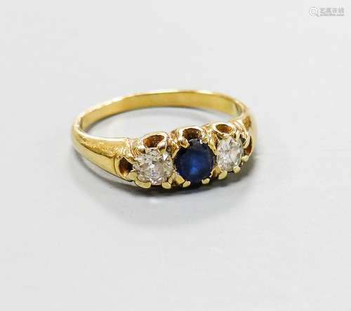 A yellow metal, sapphire and diamond set three stone ring, s...