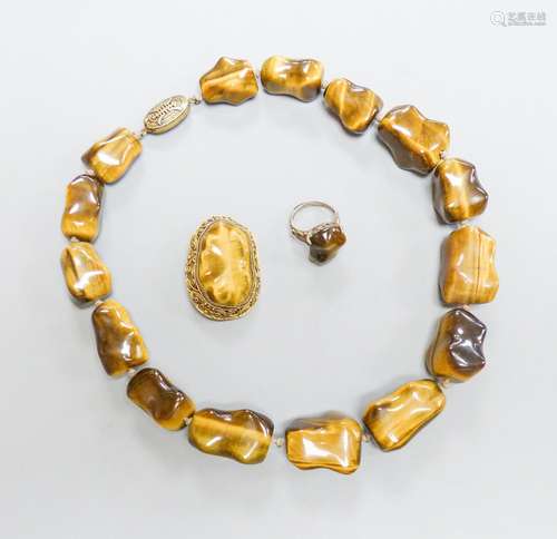 A Middle Eastern gilt white metal and tiger's eye pebble nec...