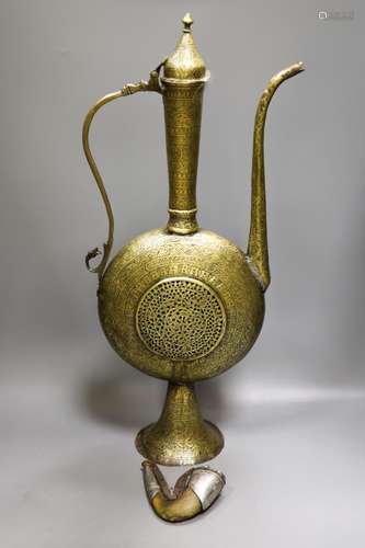 A Persian engraved brass ewer and Middle-eastern horn and wh...