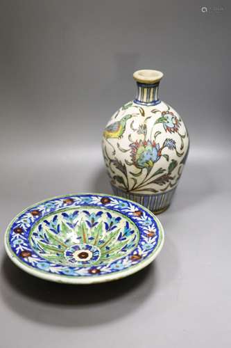 A Persian Iznik style pottery bowl and a Persian Qajar dynas...