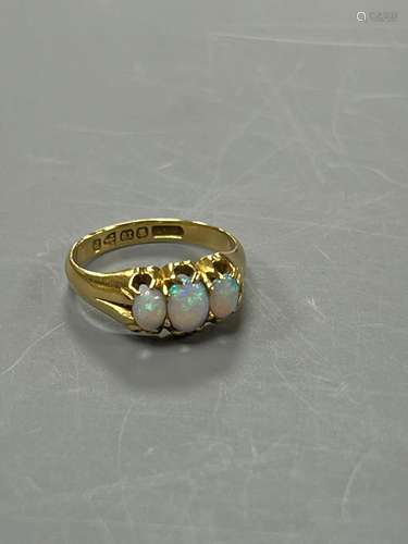 A late Victorian 18ct gold and claw set three stone white op...