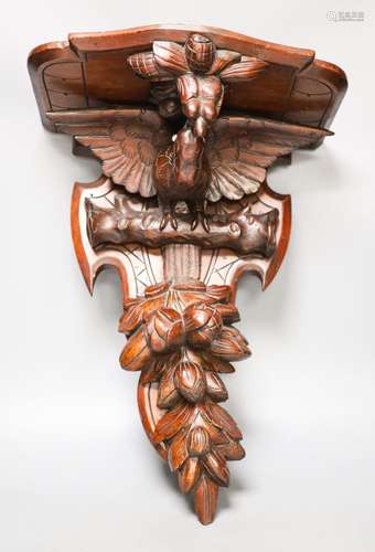 A late 19th century carved mahogany ‘eagle’ wall bracket wit...