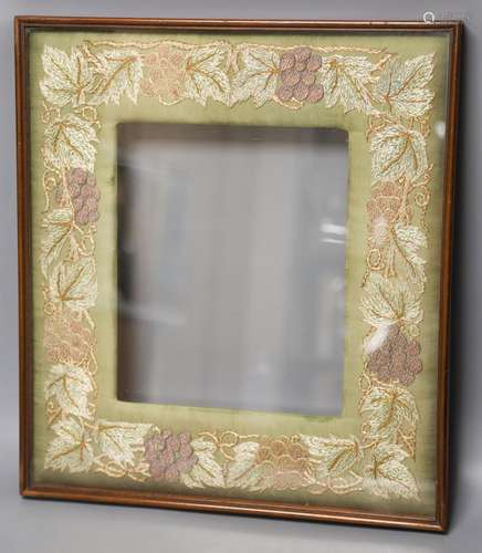 A mahogany picture frame with needlework mount48x42cm