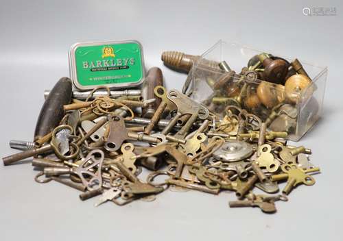 Assorted watch keys and winders and a corkscrew