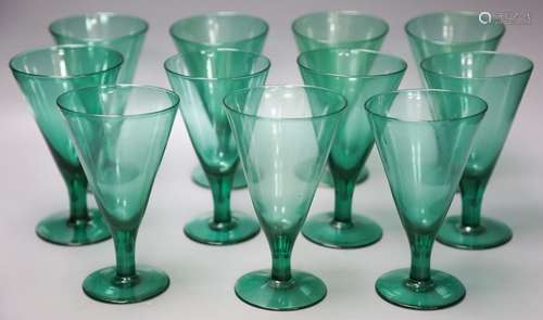 Fourteen green wine glasses