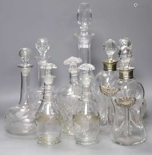 A pair of Regency small cut glass decanters, a pair of silve...