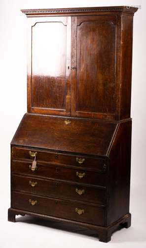 A George III oak bureau cabinet, width 108cm, depth 52cm, he...