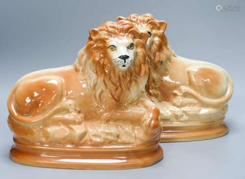 A pair of Staffordshire pottery 'lion' figures30cm