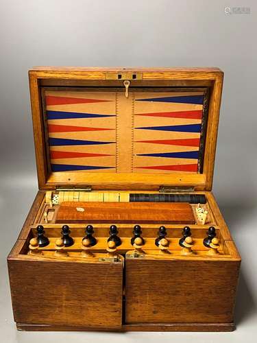 A Victorian oak games compendium,32cm wide