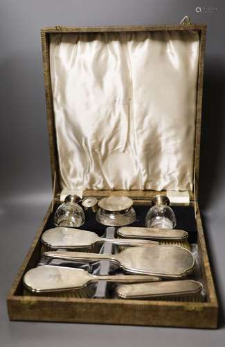 A late 1940's cased silver mounted eight piece dressing tabl...