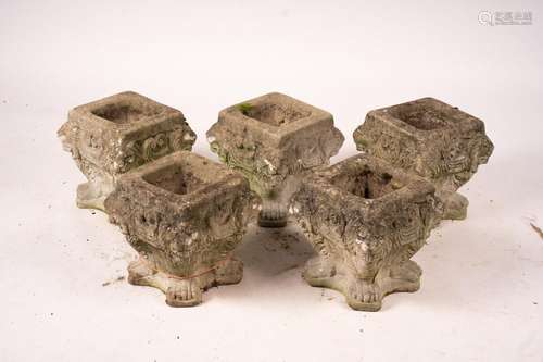 A set of five reconstituted stone lion mask square garden pl...