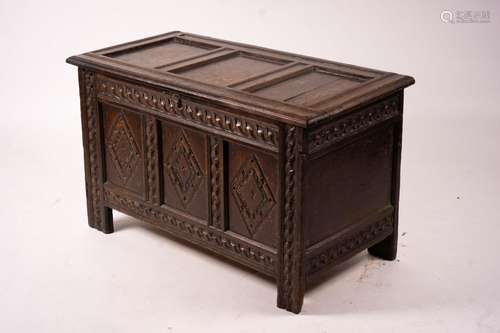 A 17th century carved panelled oak coffer, length 115cm, dep...