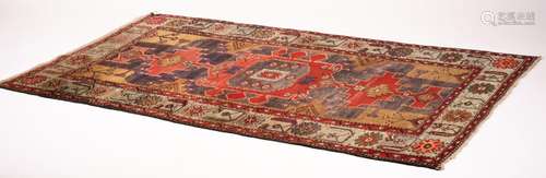 A Caucasian Kazak blue ground rug, 206 x 128cm