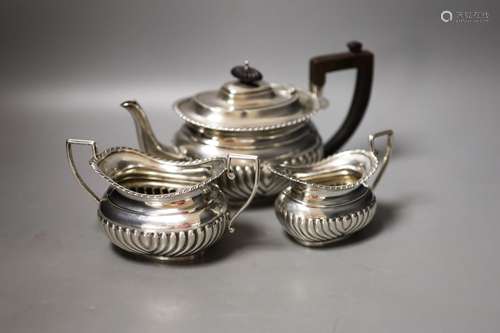 A late Victorian demi-fluted three piece tea set, Nathan & H...