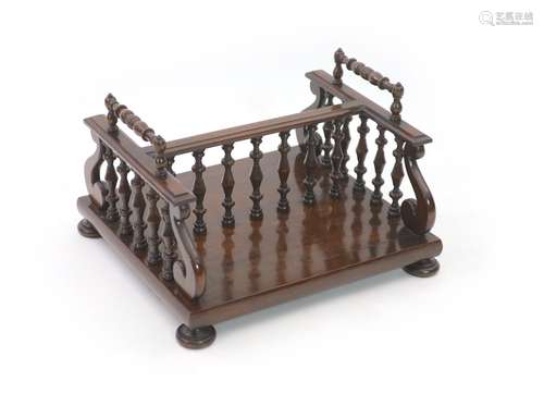 A William IV rosewood bookcarrier / rack,with ring turned ha...