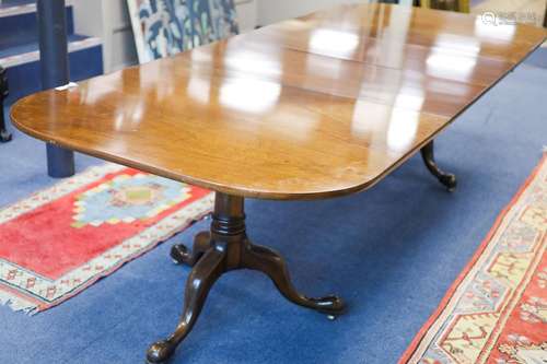 A George III style mahogany two pillar extending dining tabl...