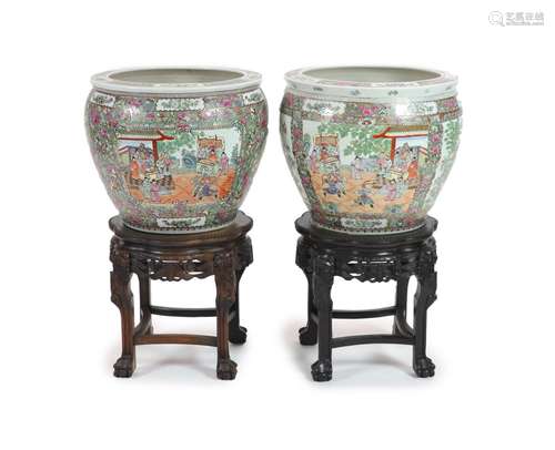 A pair of Chinese famille rose fish bowls on ebonised marble...