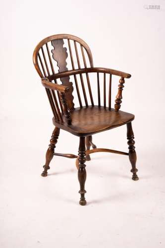 A mid 19th century yew and elm Windsor elbow chair with crin...