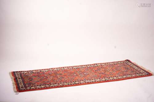 A Persian red ground runner, 202 x 83cm