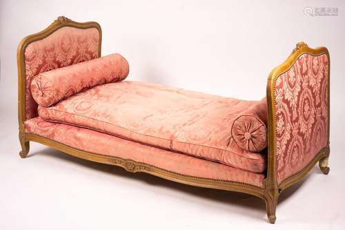 An early 20th century French carved beech daybed, length 174...