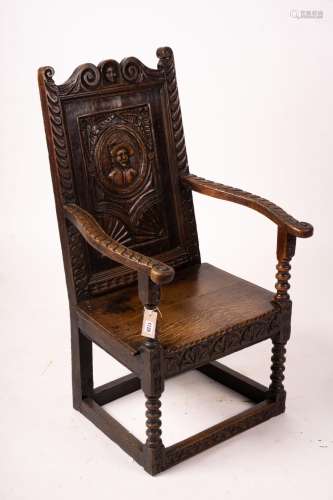 An 18th century style carved oak wainscot chair, width 56cm,...