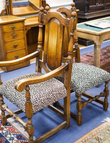 A set of ten 18th century style panelled oak dining chairs, ...