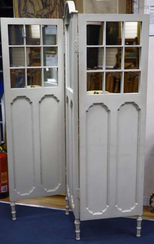 An early 20th century painted mirrored three fold dressing s...