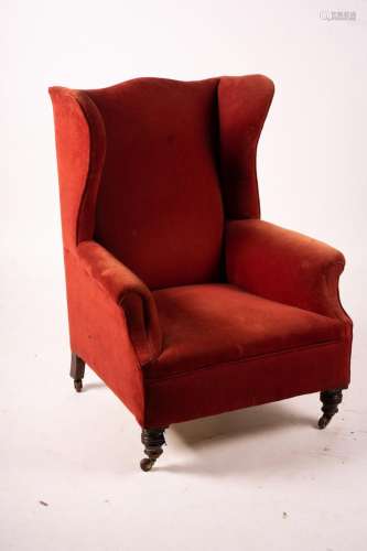A late Victorian upholstered wing armchair, width 76cm, dept...