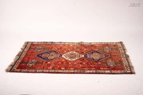 A Shiraz red ground rug geometric rug, 160 x 120cm