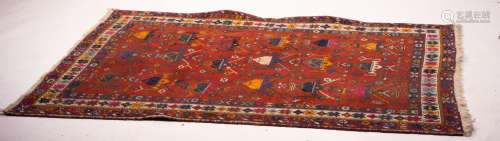 A Turkish red ground rug, 190 x 152cm