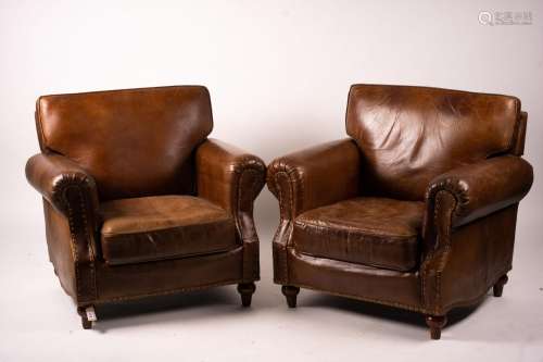 A pair of brown leather club armchairs, width 96cm, depth 80...
