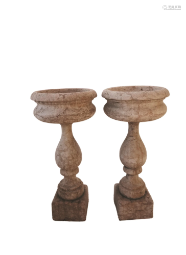 A pair of rosso di Verona marble holy water fonts