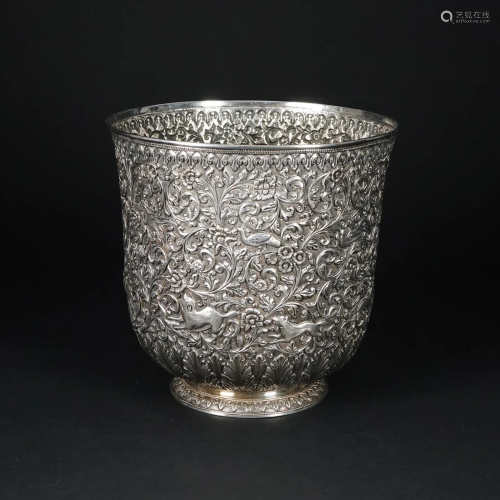 An embossed silver vase, possibly India