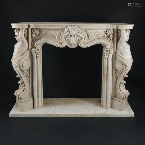 A carved white marble fireplace