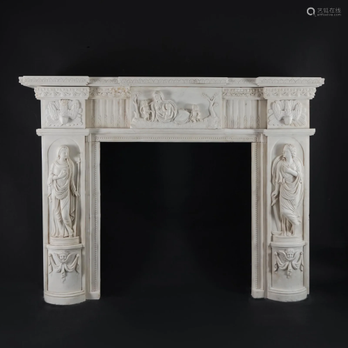 A carved white marble fireplace