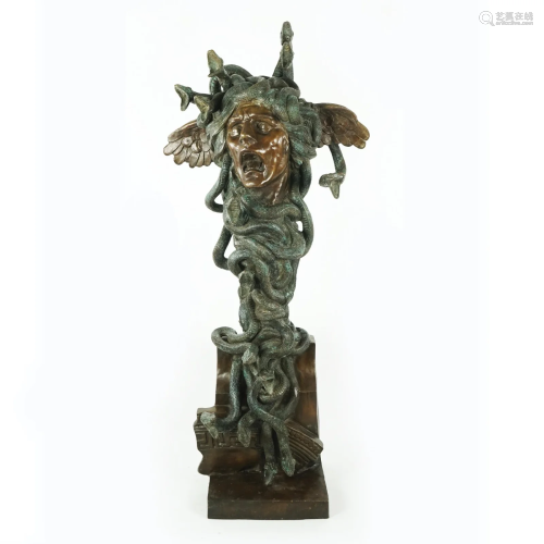 A patinated bronze sculpture of Medusa's head