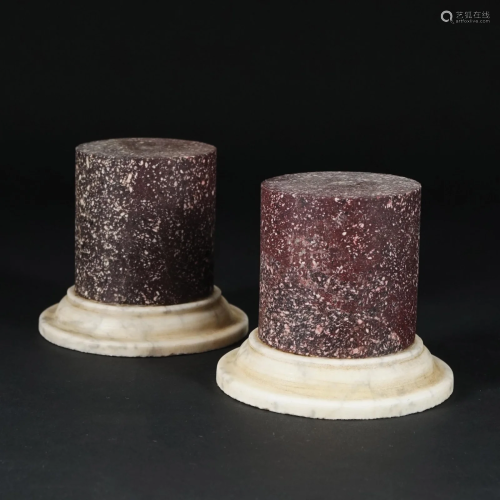 A pair of porphyry and white marble socles